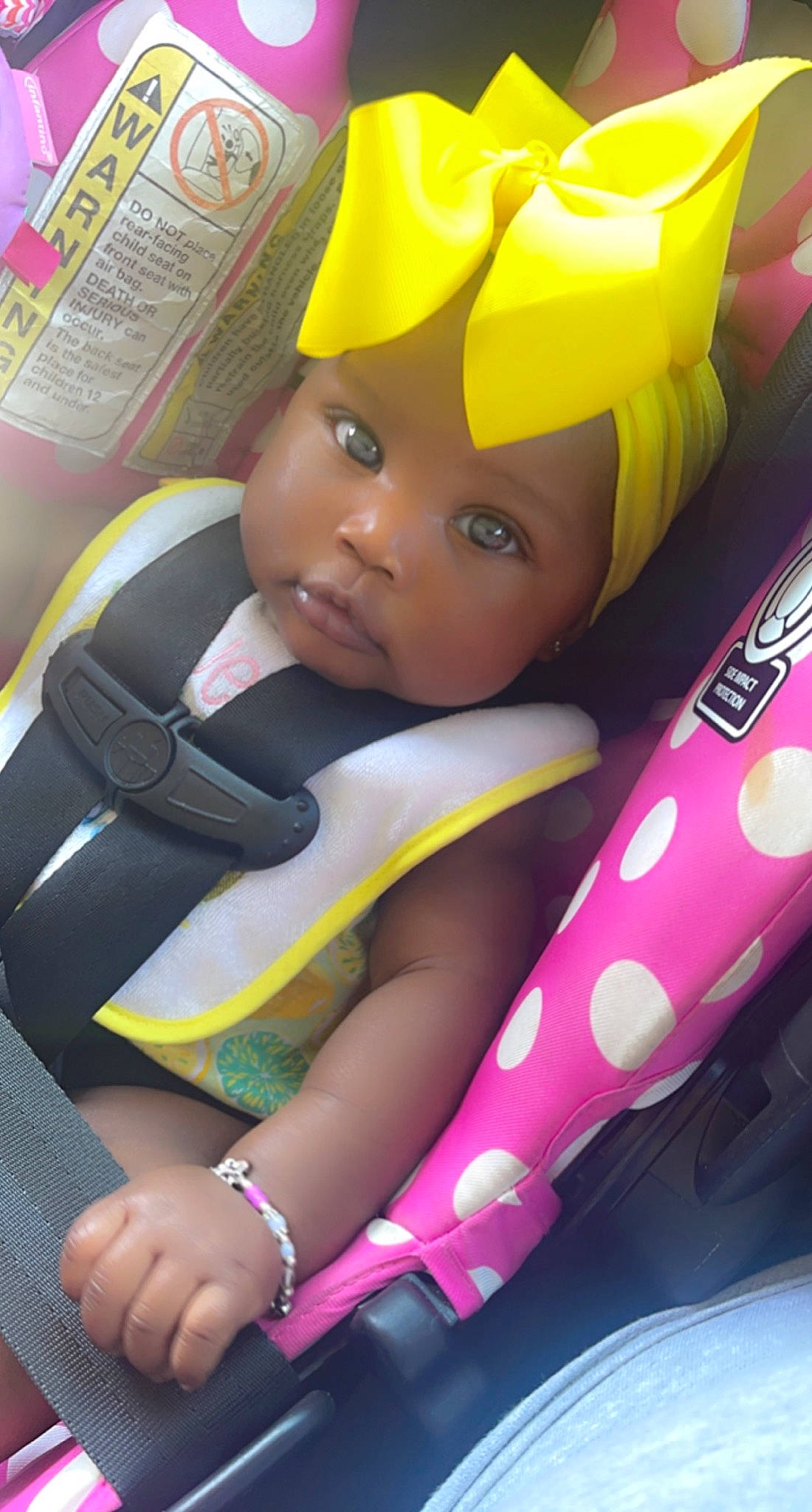 Akyra is registered to the contest to win money with this photo: baby_products, car_seat, child, doll, fashion_accessory, fictional_character, finger, fun, happy, headwear, magenta, pattern, person, personal_protective_equipment, pink, plastic, play, product, stuffed_toy, toy