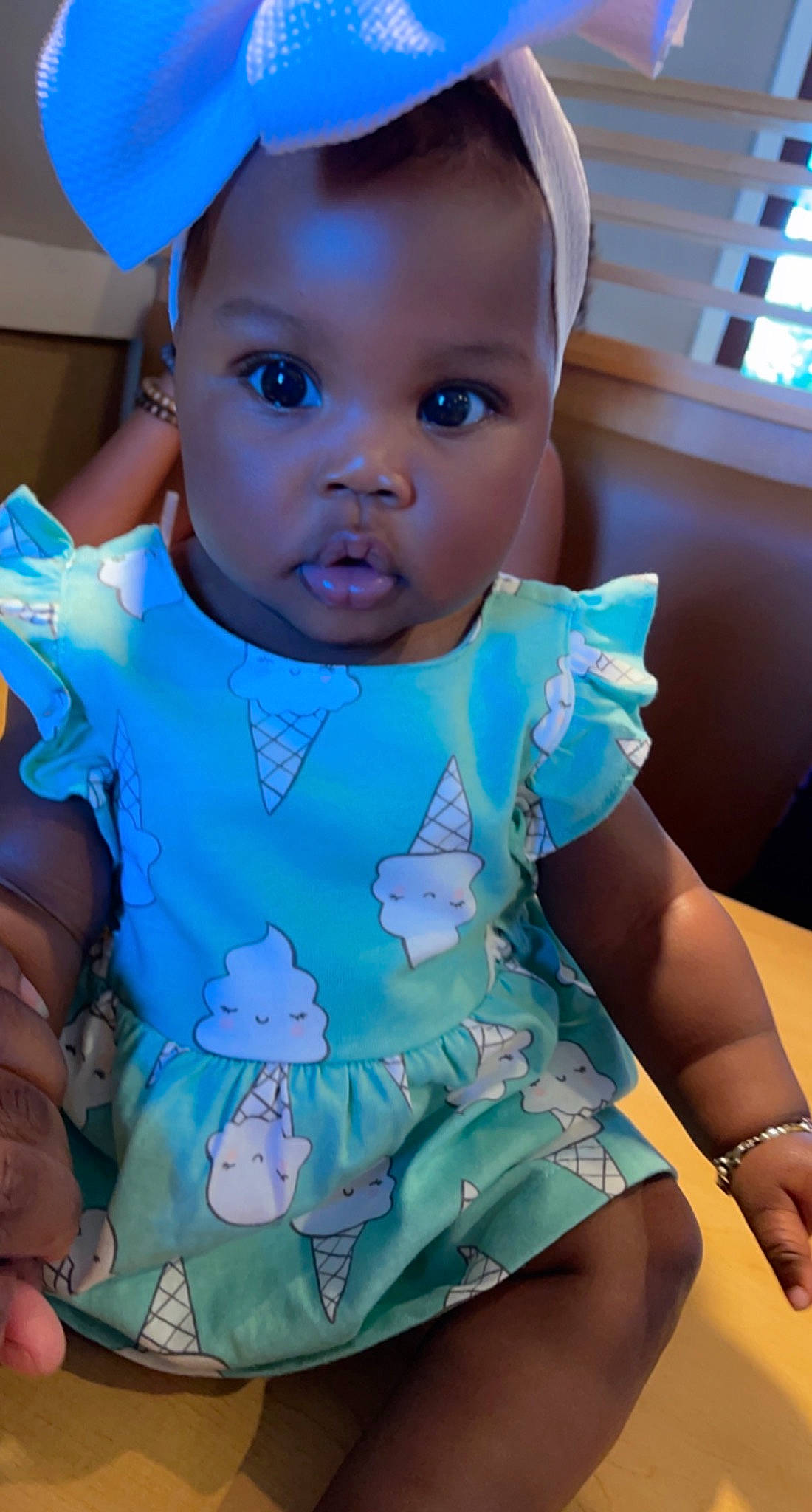 Akyra is registered to the contest to win money with this photo: azure, baby, baby_toddler_clothing, blue, child, dress, electric_blue, eye, face, finger, hand, happy, hat, iris, person, pink, skin, sleeve, textile, thigh