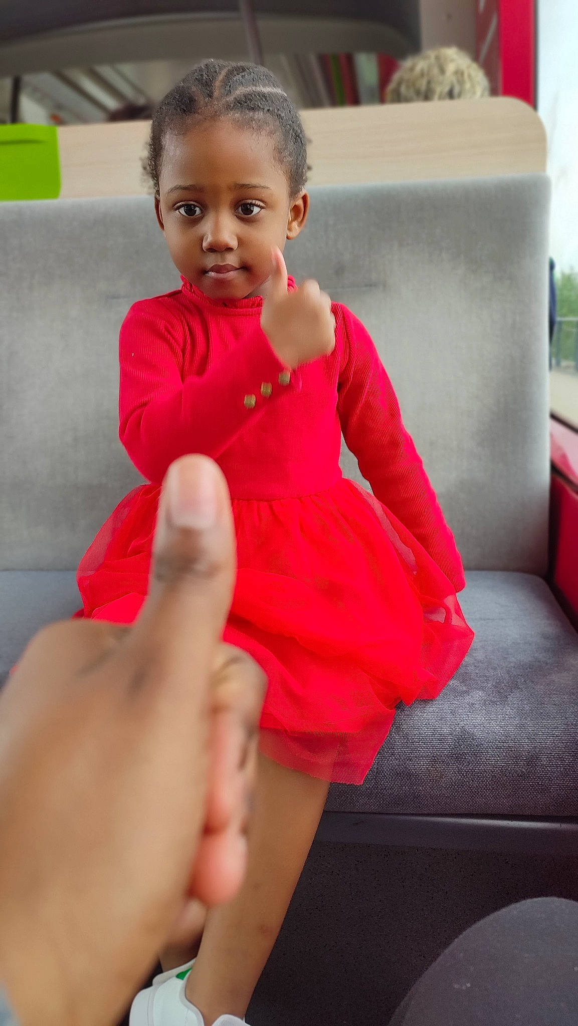 Leïla participe au concours pour gagner de l'argent avec cette photo : baby_toddler_clothing, comfort, couch, dress, eye, face, finger, gesture, hair, hand, happy, head, leg, lip, person, pink, skin, smile, thigh, thumb