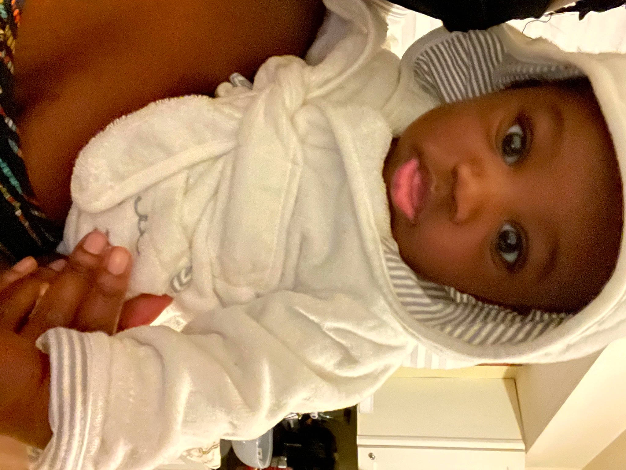 Dillon is registered to the contest to win money with this photo: baby, baby_products, baby_toddler_clothing, cheek, child, comfort, eyelash, gesture, happy, hat, human_body, mouth, neck, nose, pattern, person, skin, sleeve, thumb, toddler