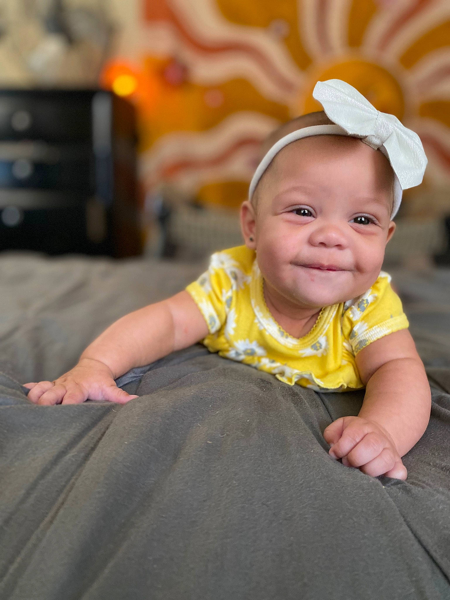 Jane is registered to the contest to win money with this photo: baby, baby_toddler_clothing, cheek, child, flash_photography, flooring, fun, grass, happy, hat, joy, leisure, person, portrait_photography, sitting, skin, sleeve, smile, t_shirt, television