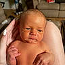 Carter is registered to the contest to win money with this photo: adult_hand, baby, child, closeup, couch, cute, diaper, expression, face, hand, human, indoor, infant, living_room, newborn, person, portrait, skin, small, tender
