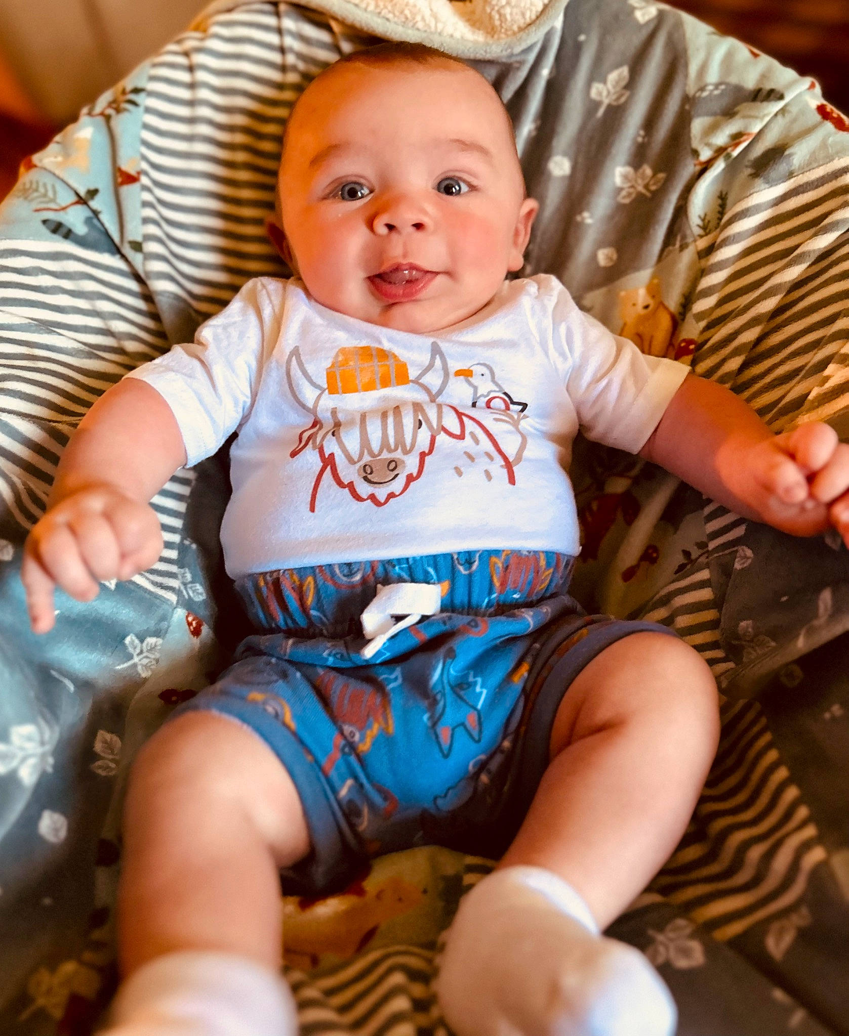 Boone joined the competition — help win amazing prizes! baby, baby_products, baby_toddler_clothing, bib, chair, cheek, child, comfort, eye, fun, happy, human_leg, iris, lap, person, sitting, skin, sleeve, t_shirt, thigh