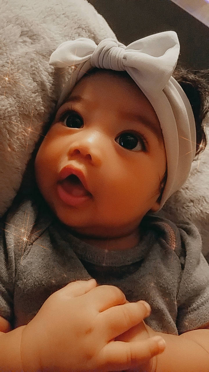 Lyra joined the competition — help win amazing prizes! baby, cap, cheek, comfort, ear, eye, eyebrow, eyelash, finger, gesture, happy, head, headwear, helmet, iris, lip, mouth, nose, person, skin