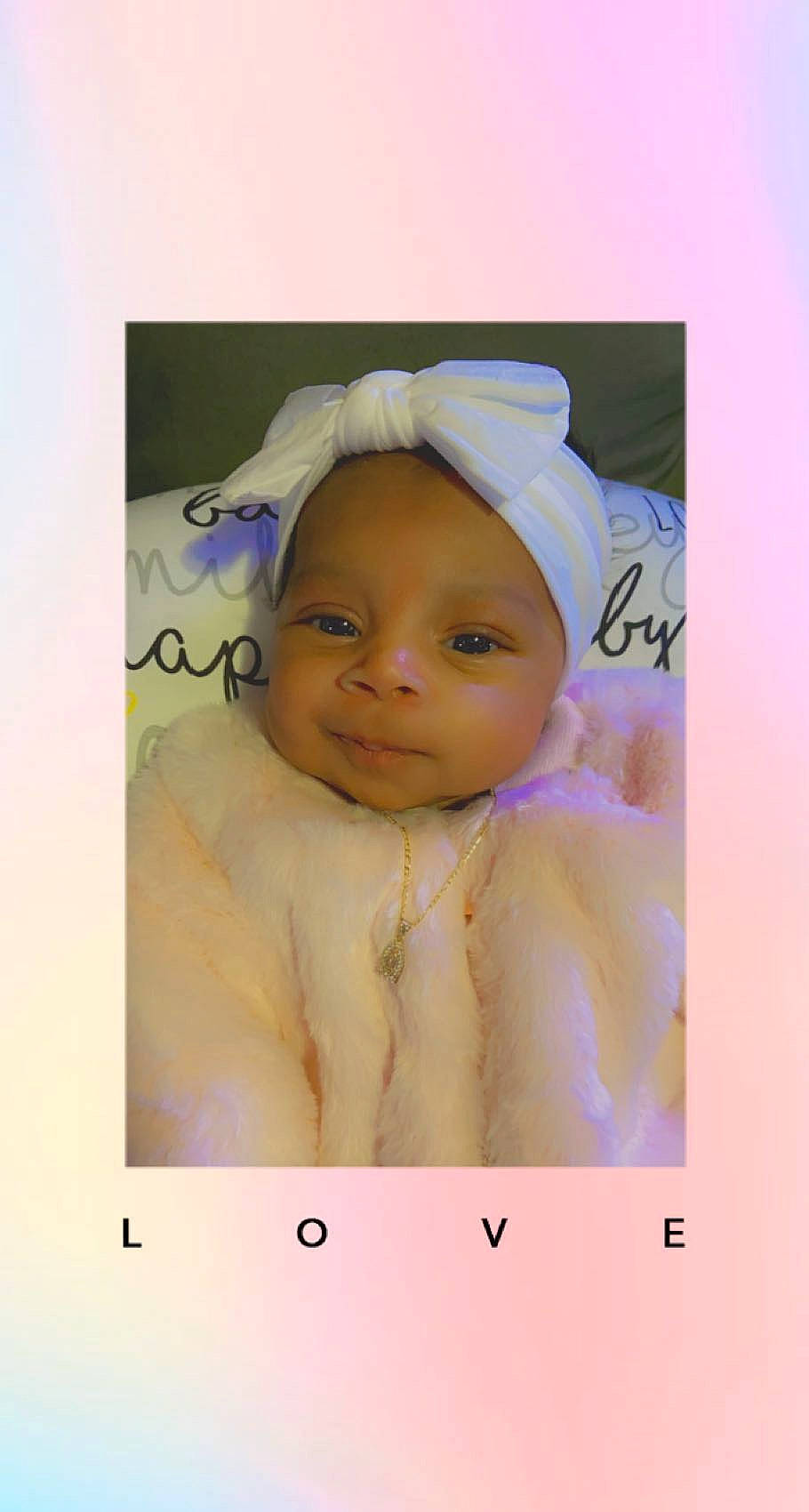 Timia is registered to the contest to win money with this photo: art, baby, baby_toddler_clothing, cheek, child, eyebrow, eyelash, face, fashion_accessory, happy, headgear, magenta, person, photo_caption, photomontage, picture_frame, rectangle, room, sleeve, smile