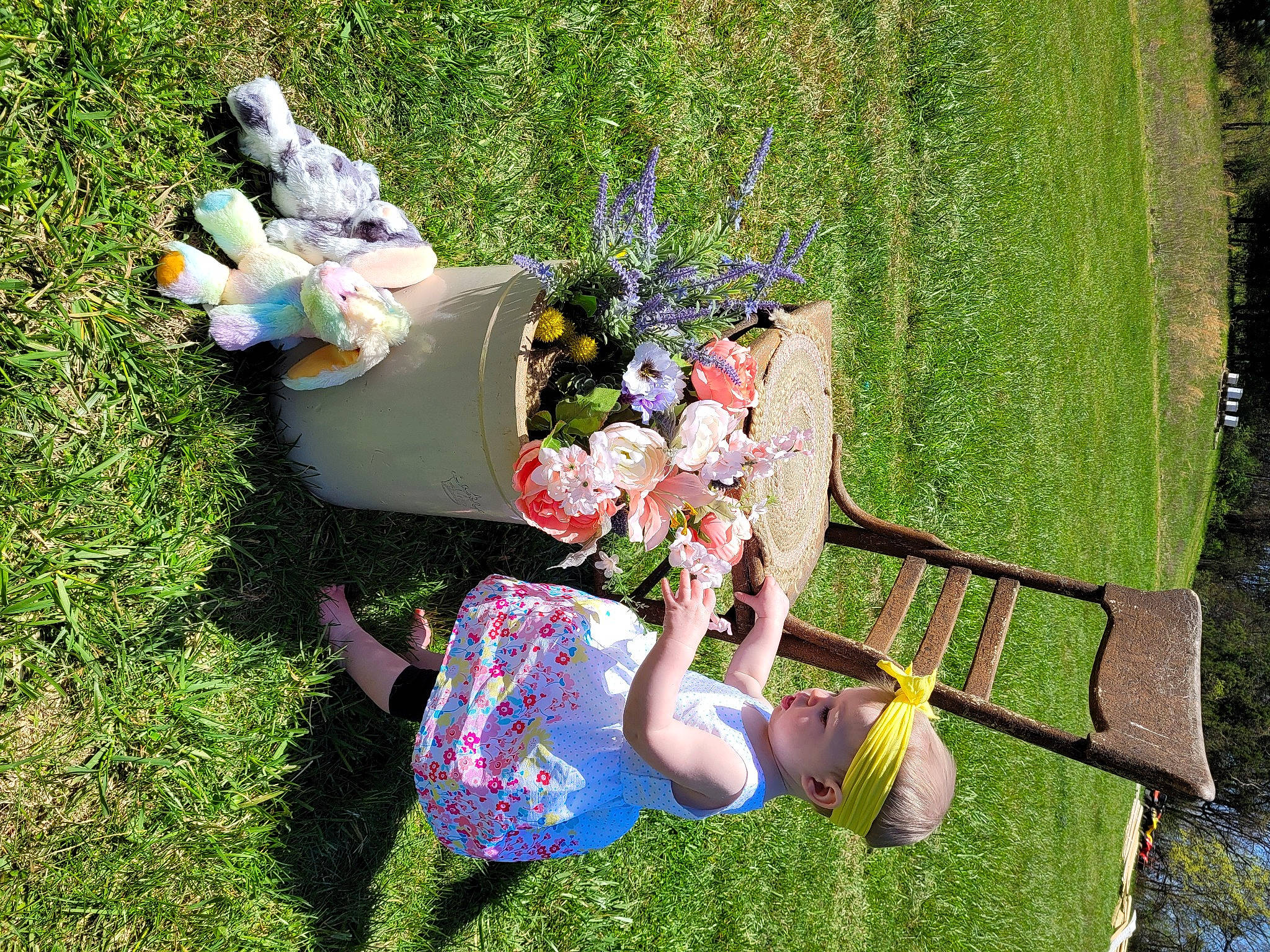 Emberleigh is registered to the contest to win money with this photo: art, botany, flower, garden, grass, grass_family, green, happy, lawn, lawn_ornament, leisure, meadow, outdoor_furniture, people_in_nature, person, plant, recreation, shrub, sitting, toy