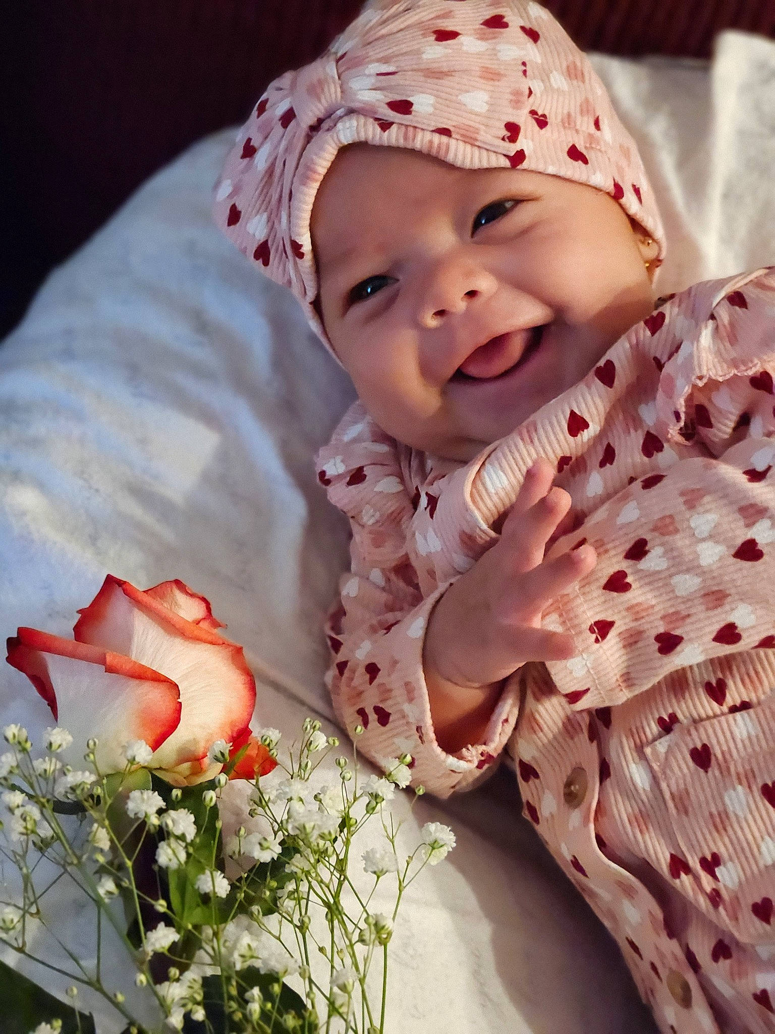 Matilda joined the competition — help win amazing prizes! baby, baby_toddler_clothing, cap, face, flower, happy, head, headwear, linens, lip, pattern, people_in_nature, person, petal, pink, plant, rose, skin, sleeve, smile