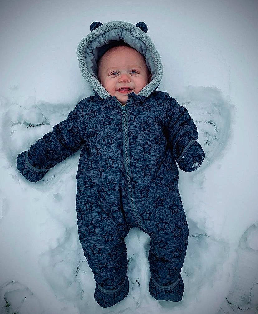 Kaiden joined the competition — help win amazing prizes! baby, baby_toddler_clothing, cheek, face, freezing, fur, gesture, glove, happy, headgear, hood, jacket, mammal, parka, person, personal_protective_equipment, sleeve, smile, snow, toddler
