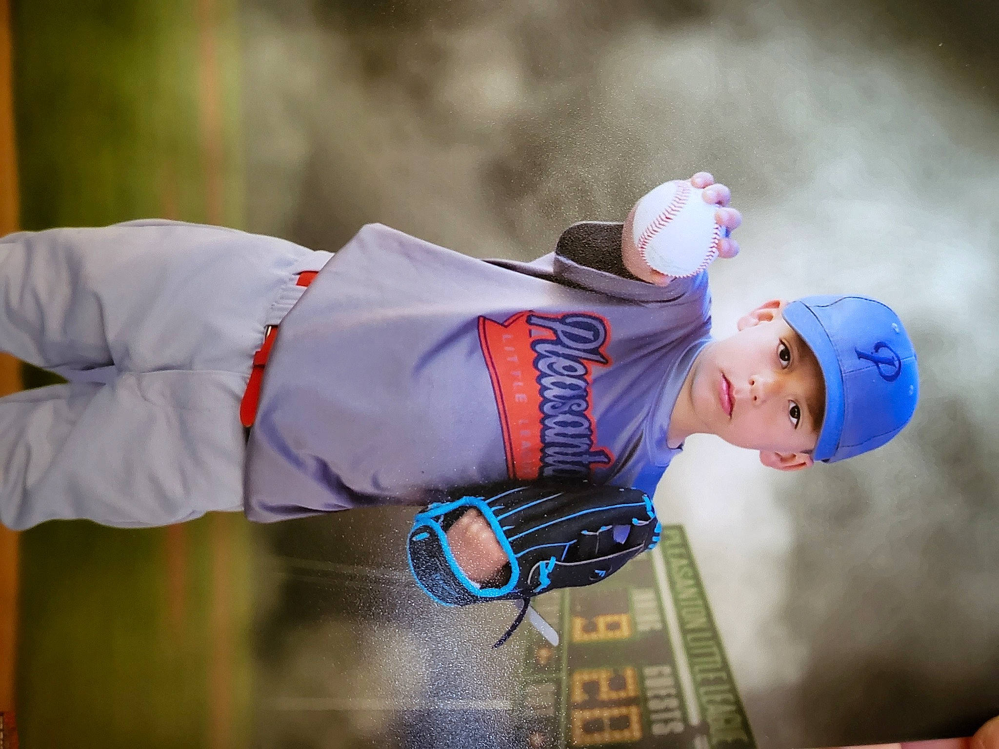 Xaiden is registered to the contest to win money with this photo: child, electric_blue, event, fashion_accessory, flag, flash_photography, fun, gesture, happy, hat, headwear, leisure, person, personal_protective_equipment, portrait_photography, recreation, tradition, uniform, winter