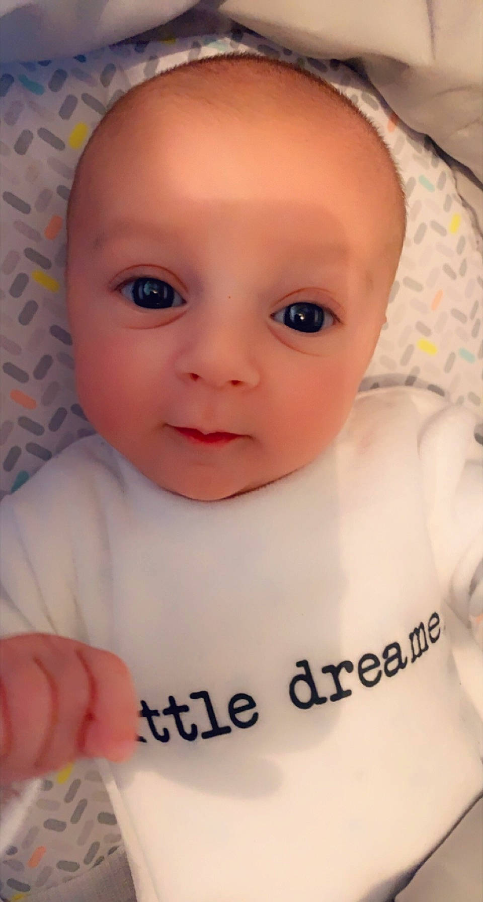 Mylo participe au concours pour gagner de l'argent avec cette photo : baby, baby_toddler_clothing, cheek, chest, child, chin, close_up, eye, eyebrow, eyelash, facial_expression, iris, lip, mouth, nose, person, pink, product, skin, sleeve