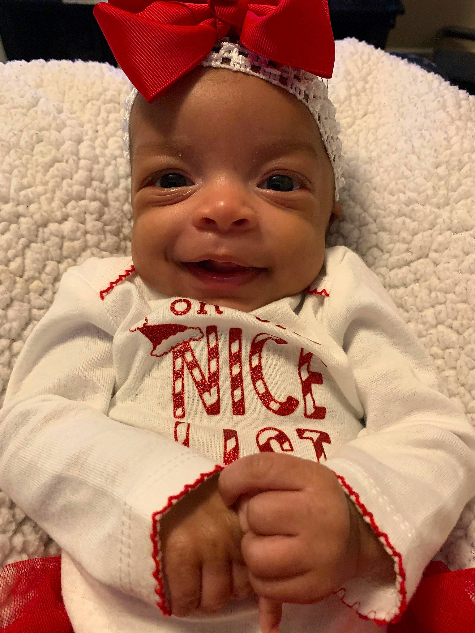 Taziyah is registered to the contest to win money with this photo: baby, cheek, child, facial_expression, finger, hair_accessory, happy, head, headgear, lip, person, skin, smile, toddler