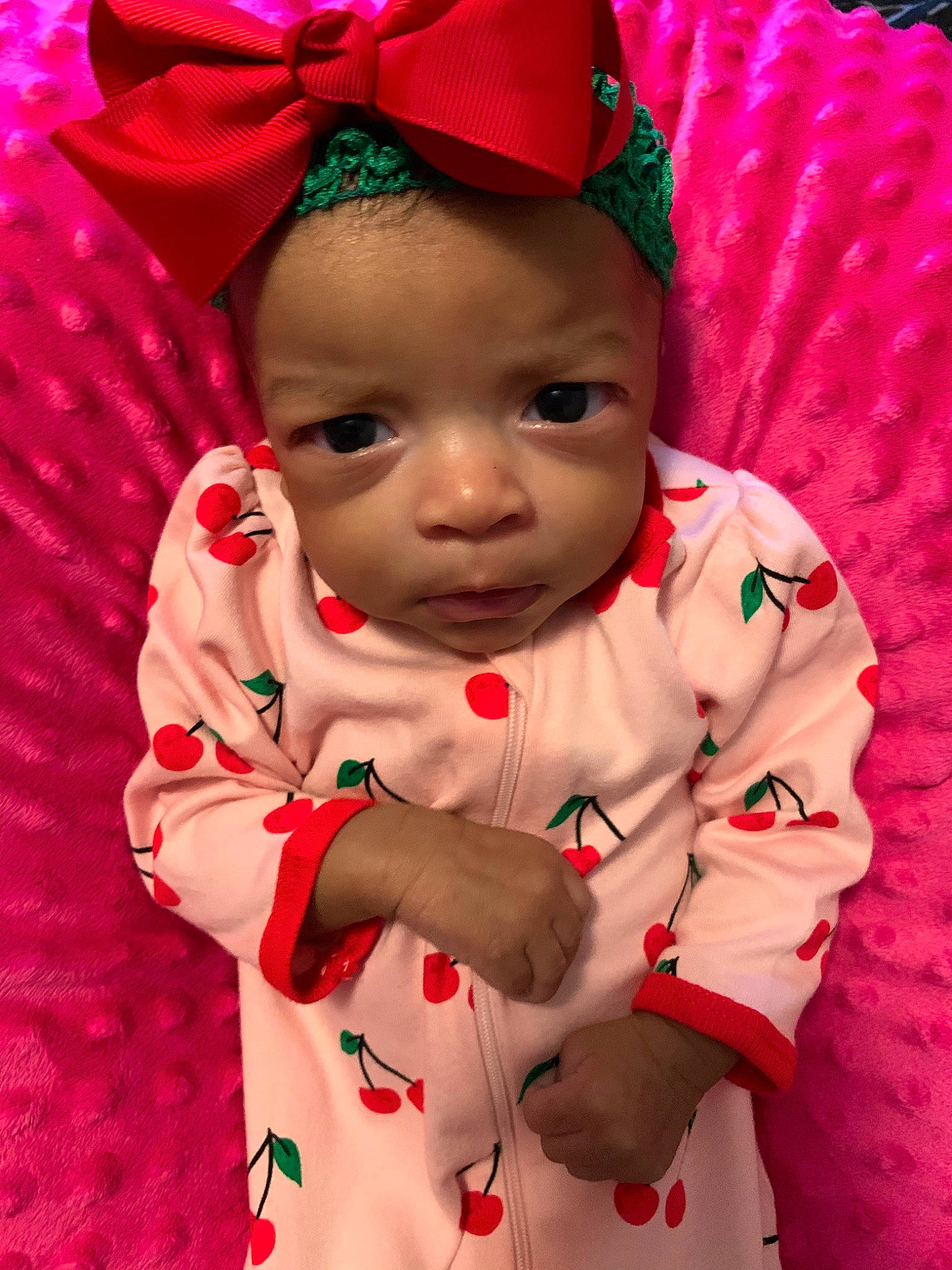 Taziyah is registered to the contest to win money with this photo: baby, baby_products, baby_toddler_clothing, cheek, child, hair_accessory, person, pink, red, smile, toddler