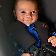 Rivah joined the competition — help win amazing prizes! baby, child, infant, smiling, face, portrait, car_seat, safety_harness, seatbelt, vehicle_interior, blue_clothing, brown_hair, happy, sitting, indoors, close_up, photography, heart_symbol, hands, safe_travel