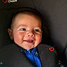 Rivah is registered to the contest to win money with this photo: baby, child, infant, car_seat, harness, portrait, close_up, smiling, tongue_out, face, eyes, blue_clothing, indoor, vehicle, safety, seated, happy, cute, photography, family