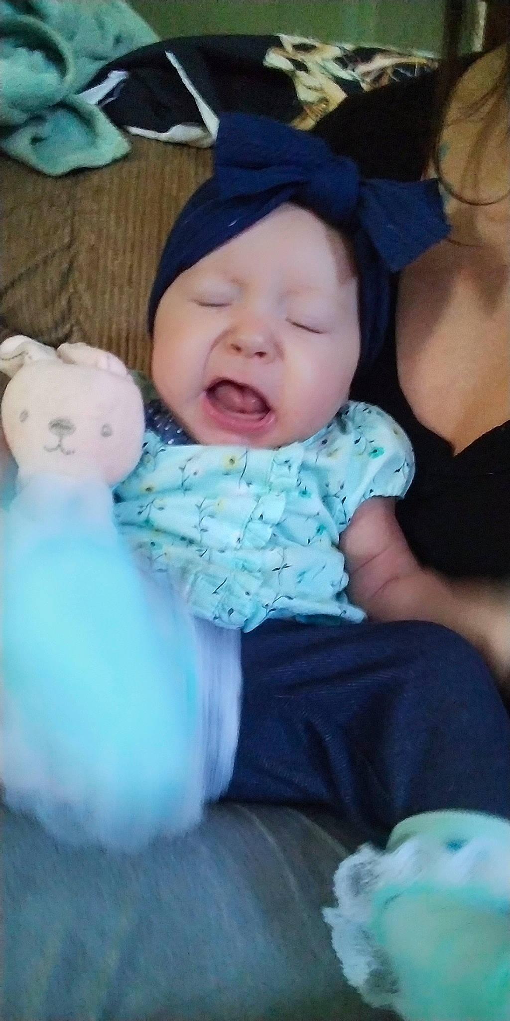 Kya is registered to the contest to win money with this photo: azure, baby, baby_toddler_clothing, cap, cheek, child, comfort, event, facial_expression, fun, fur, happy, headwear, iris, person, pink, purple, sitting, skin, smile