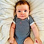 Constance a rejoint le concours — aidez-le/la à gagner de superbes lots ! baby, infant, child, smiling, blue_eyes, striped_clothing, onesie, soft_blanket, fluffy, cute, portrait, skin, hand, leg, lying_down, comfort, indoors, young, person, happy