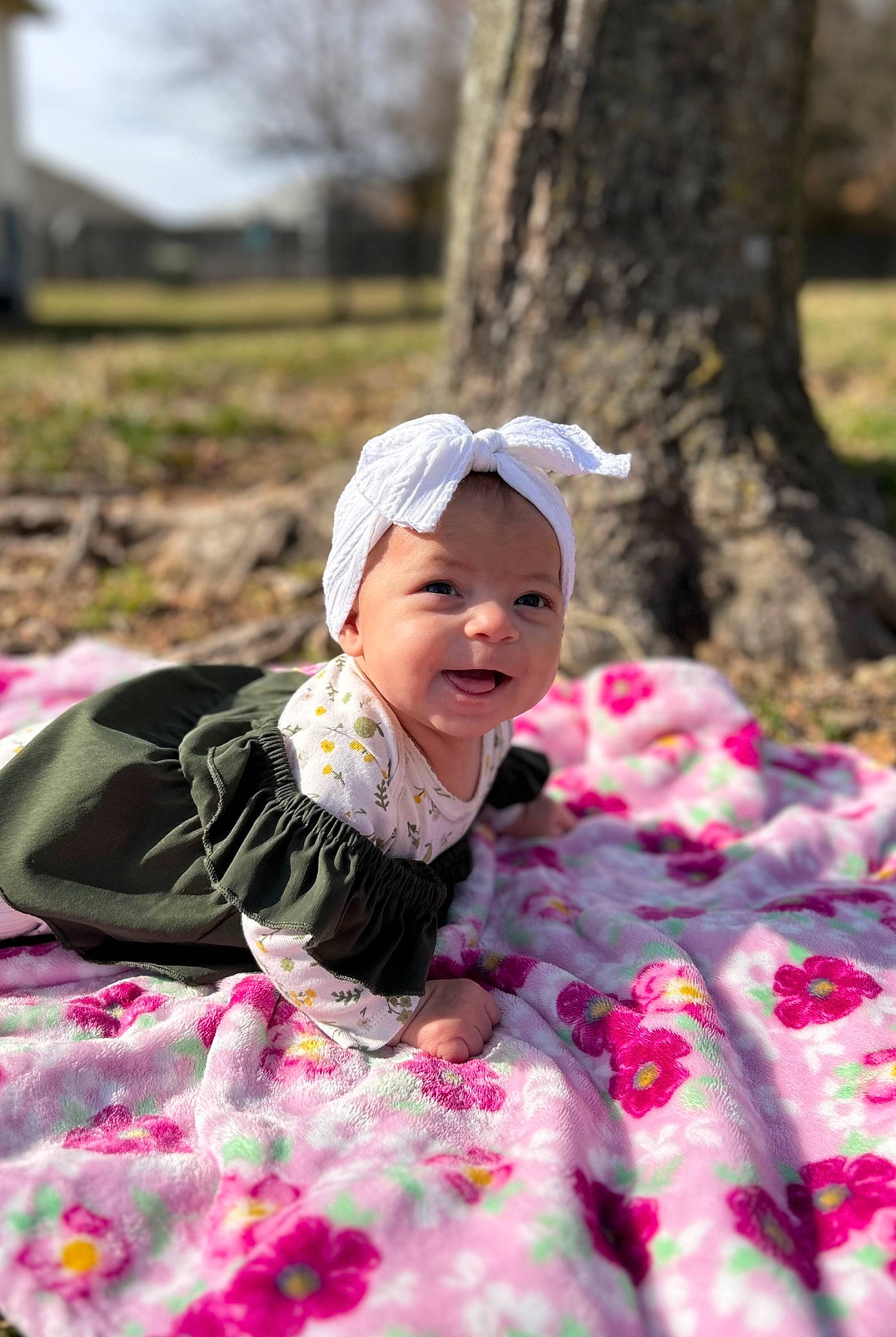 Iliana Jesil is registered to the contest to win money with this photo: baby, baby_toddler_clothing, eye, fun, grass, happy, headwear, leisure, magenta, pattern, people_in_nature, person, petal, photograph, pink, plant, recreation, sitting, smile, spring