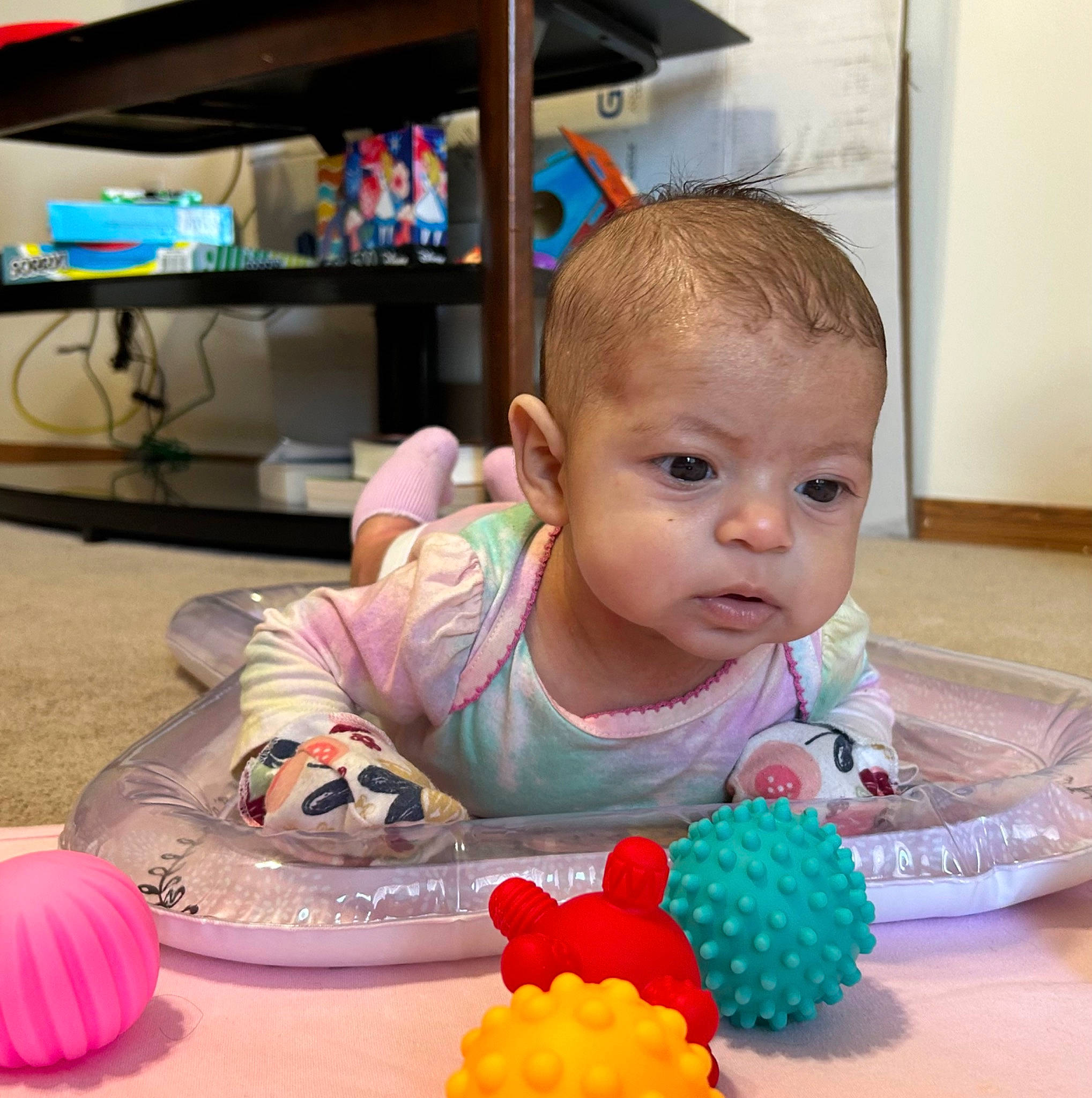 Iliana Jesil joined the competition — help win amazing prizes! baby, baby_playing_with_toys, baby_products, baby_toddler_clothing, baby_toys, child, flooring, fun, person, play, room, shelf, sitting, sweetness, table, television, toddler, toy