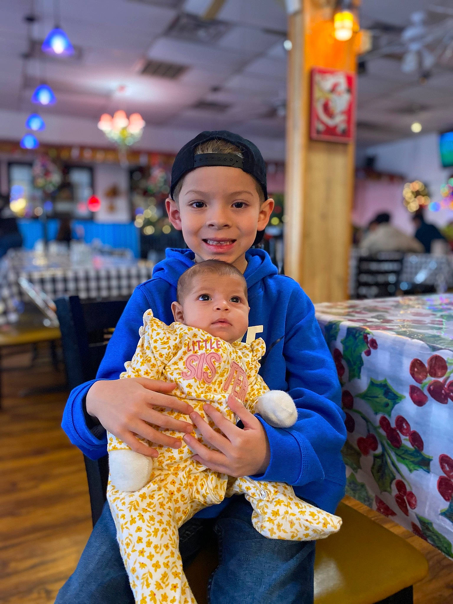 Julian Hernan joined the competition — help win amazing prizes! chair, child, cuisine, dessert, event, facial_expression, fun, happy, headwear, joy, junk_food, leisure, party, person, play, recreation, room, sitting, smile, sweetness