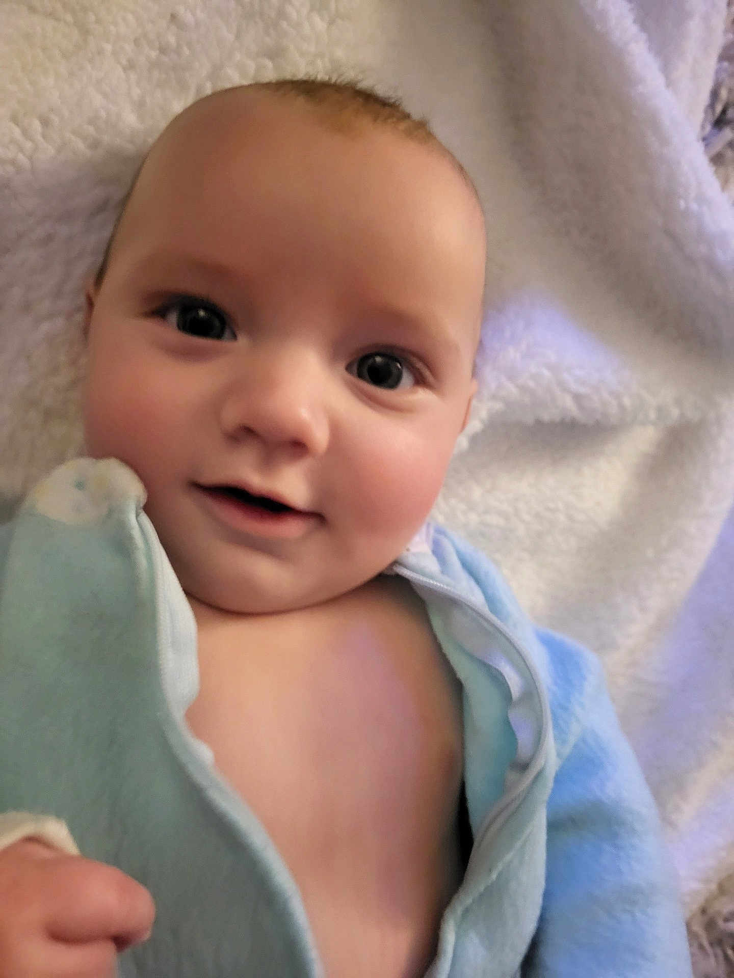 Codi joined the competition — help win amazing prizes! baby, babylaughing, blanket, bodypart, clothing, face, finger, hand, happy, head, laughing, mouth, newborn, person, photography, portrait, quilt, smile, teeth, towel