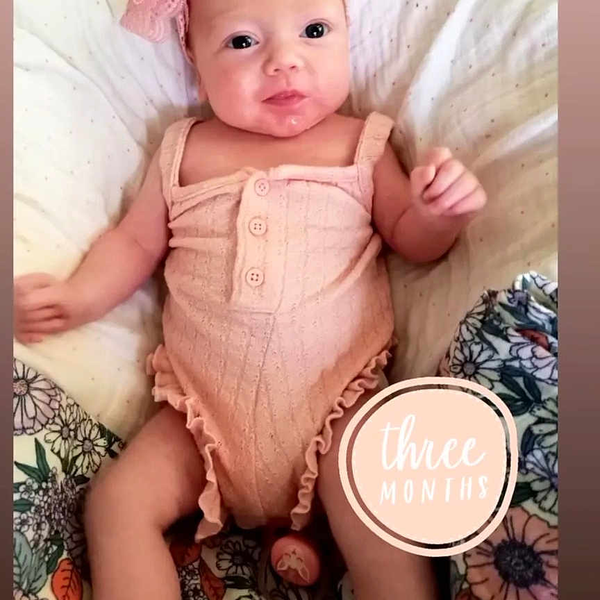Indiana is registered to the contest to win money with this photo: baby, bed, bedroom, clothing, cushion, dress, face, furniture, happy, hat, head, homedecor, indoors, newborn, person, photography, portrait, room, sitting, smile