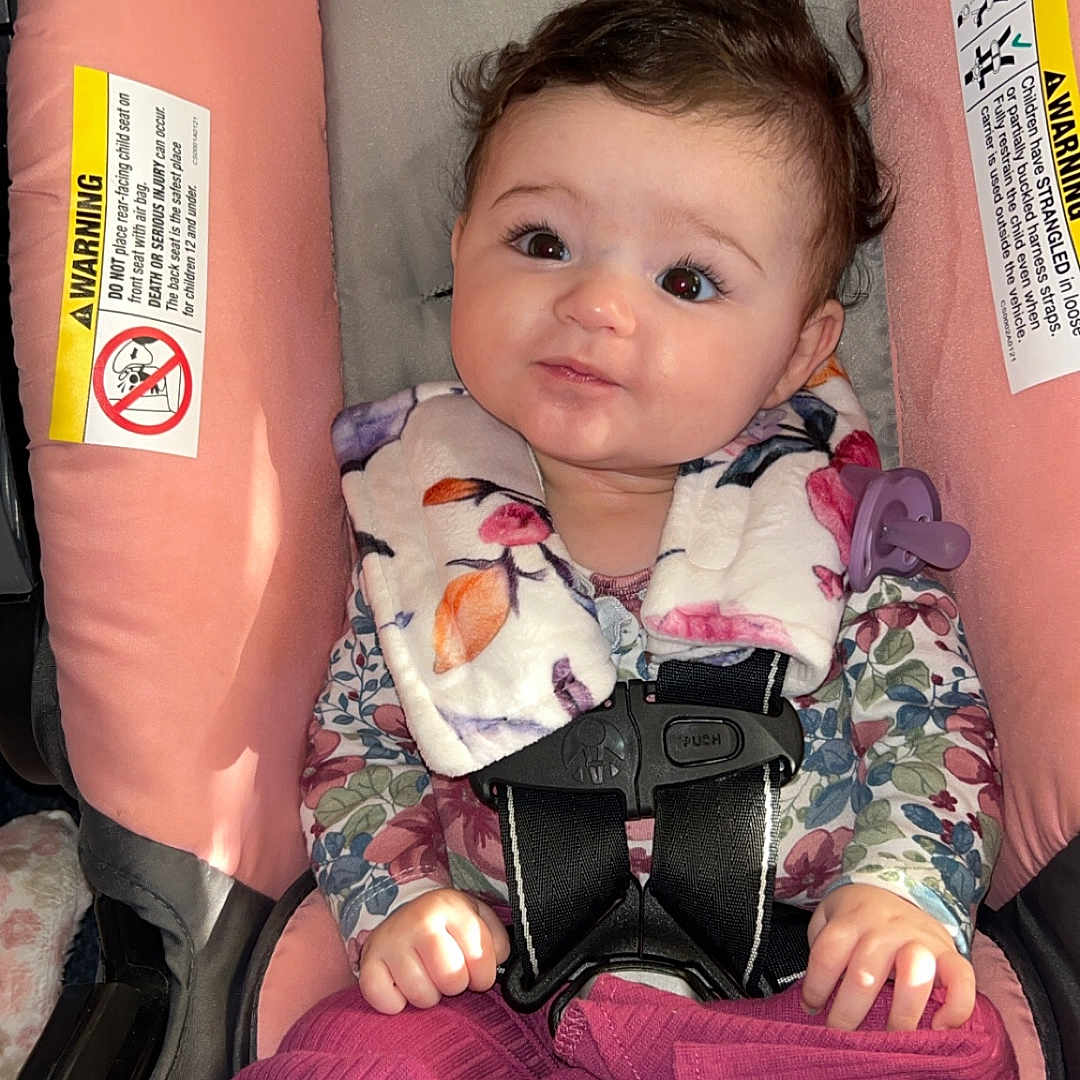 Taejah is registered to the contest to win money with this photo: baby, bodypart, car, car_interior, clothing, cushion, face, finger, gun, hand, head, homedecor, pants, person, photography, portrait, stroller, transportation, vehicle, weapon