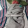 Daniel is registered to the contest to win money with this photo: newborn, baby, sleeping, hat, crocheted, green, ears, swaddle, gray, blanket, striped, bed, infant, cute, resting, cozy, child, portrait, indoors, peaceful