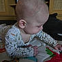 River joined the competition — help win amazing prizes! baby, child, infant, onesie, play_mat, indoor, furniture, crawling, colorful, patterned_clothing, head, hand, skin, baby_garment, curious, young_child, home, floor, toy, portrait