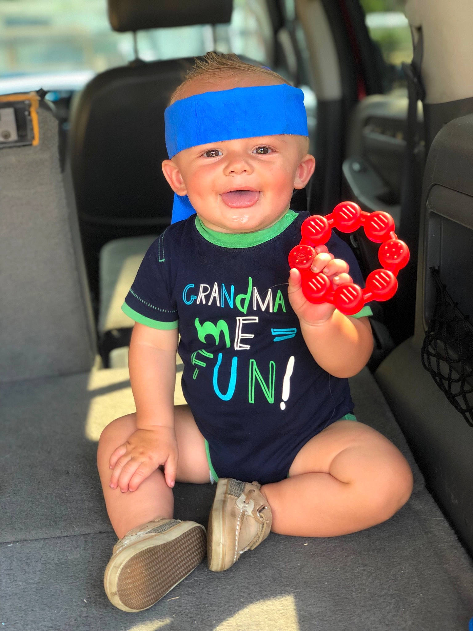 Caysen joined the competition — help win amazing prizes! arm, baby, cap, car_seat, child, hat, headgear, headwear, leg, person, sitting, standing, toddler, vacation
