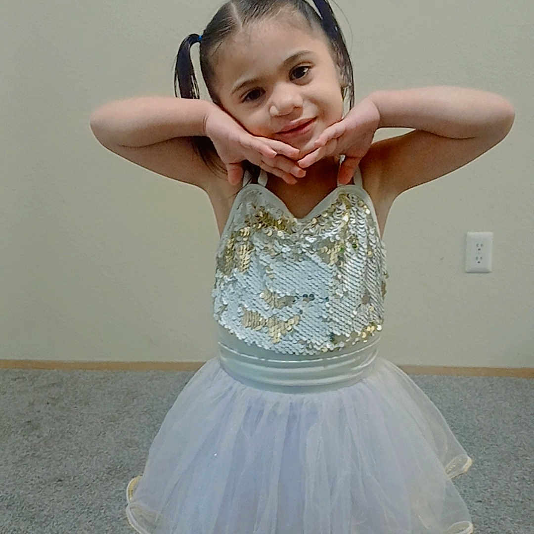 Miracle is registered to the contest to win money with this photo: accessories, child, clothing, dancing, dress, eveningdress, face, female, footwear, formalwear, girl, head, jewelry, leisureactivities, necklace, person, photography, portrait, sandal, skirt