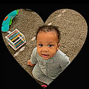 Jaymier is registered to the contest to win money with this photo: toddler, child, baby, onesie, carpet, toy, colorful_toy, floor, heart_shape, indoor, looking_up, curious, sitting, young_child, playtime, soft_lighting, casual, portrait, cute, infant