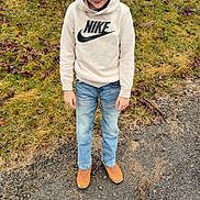 Abal is registered to the contest to win money with this photo: boots, boy, casual_clothing, child, expression, fall, grass, ground, hoodie, jeans, leaf_litter, nature, nike, outdoor, person, shrub, smile, standing, tree, young