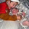 Oaklee is registered to the contest to win money with this photo: animal_costume, baby, bed, blanket, child, clothing, costume, cuddling, cute, face, family, happy, indoor, infant, joy, person, pillow, sibling, smiling, toddler