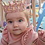 Sofia joined the competition — help win amazing prizes! baby, crown, pink_outfit, child, indoor, playroom, toy, chair, table, carpet, cute, infant, face, person, curious, seated, decor, soft_lighting, young_child, smiling