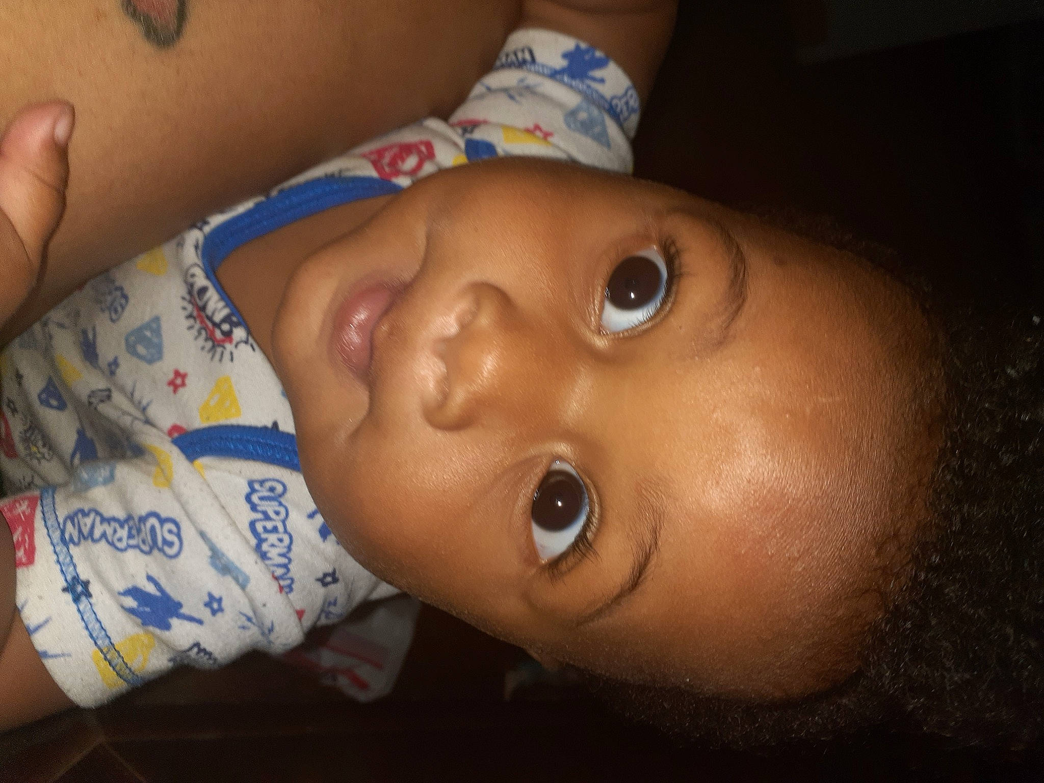 Jabari is registered to the contest to win money with this photo: baby, cheek, chin, ear, eyebrow, eyelash, facial_expression, finger, forehead, happy, headgear, human_body, iris, lip, mouth, neck, nose, person, skin, smile