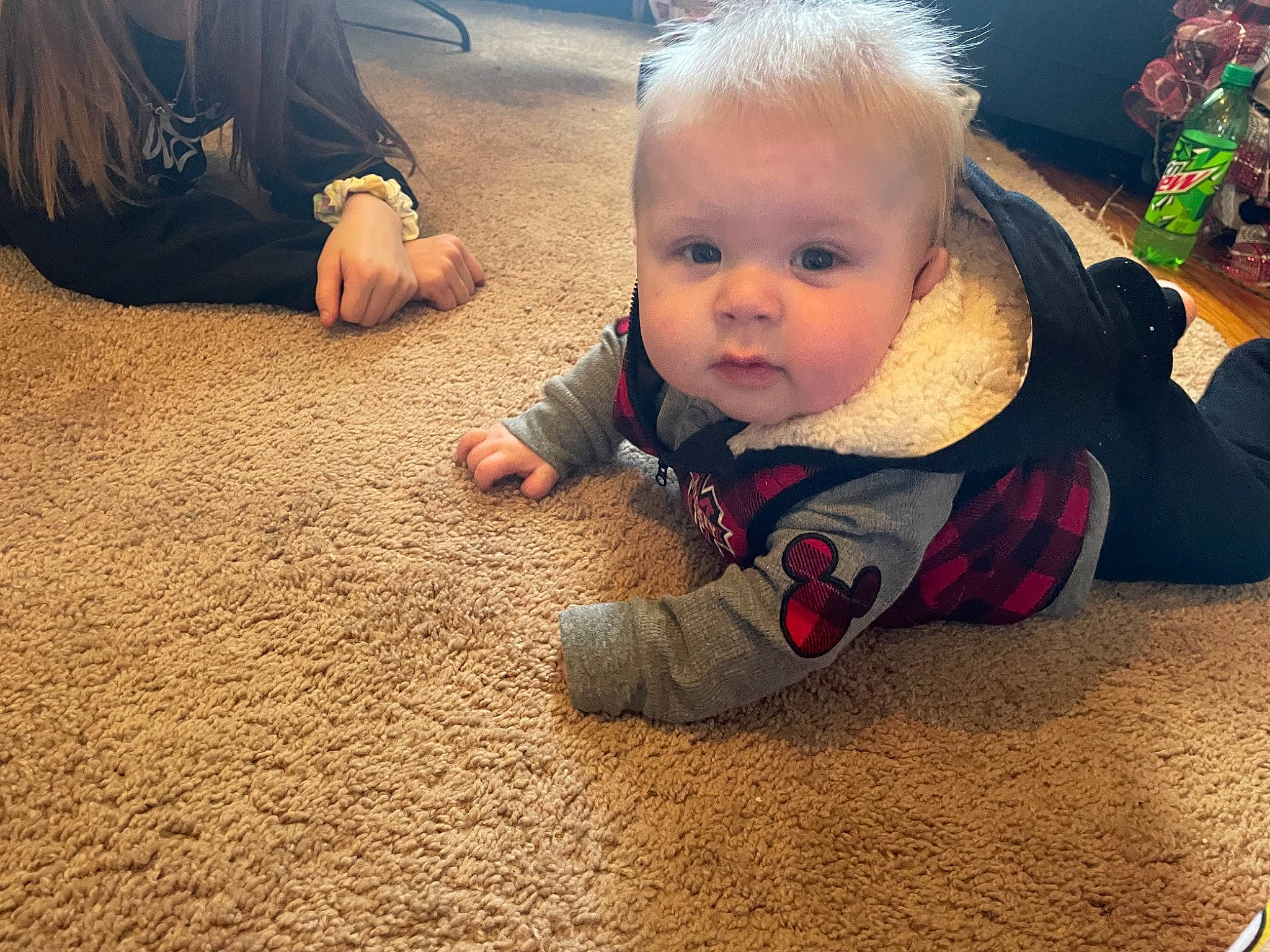 Haiden is registered to the contest to win money with this photo: adaptation, baby, baby_toddler_clothing, cheek, child, comfort, finger, floor, flooring, foot, fun, gesture, grass, happy, people_in_nature, person, sitting, smile, soil, toddler