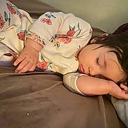 Arabelle joined the competition — help win amazing prizes! baby, sleeping, child, face, hand, onesie, floral_pattern, bed, pillow, blanket, indoors, cute, peaceful, rest, infant, soft_lighting, portrait, toddler, cozy, relaxation