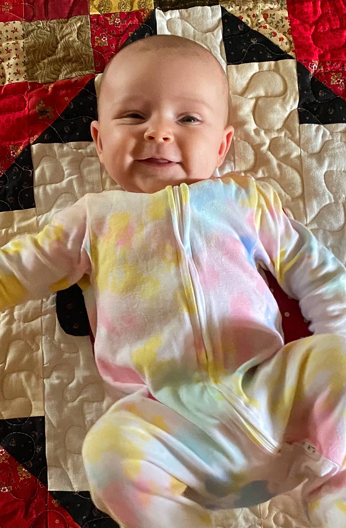 Mena is registered to the contest to win money with this photo: baby, baby_toddler_clothing, cheek, child, eye, facial_expression, happy, head, iris, linens, magenta, outerwear, person, pink, skin, sleeve, smile, t_shirt, textile, toddler