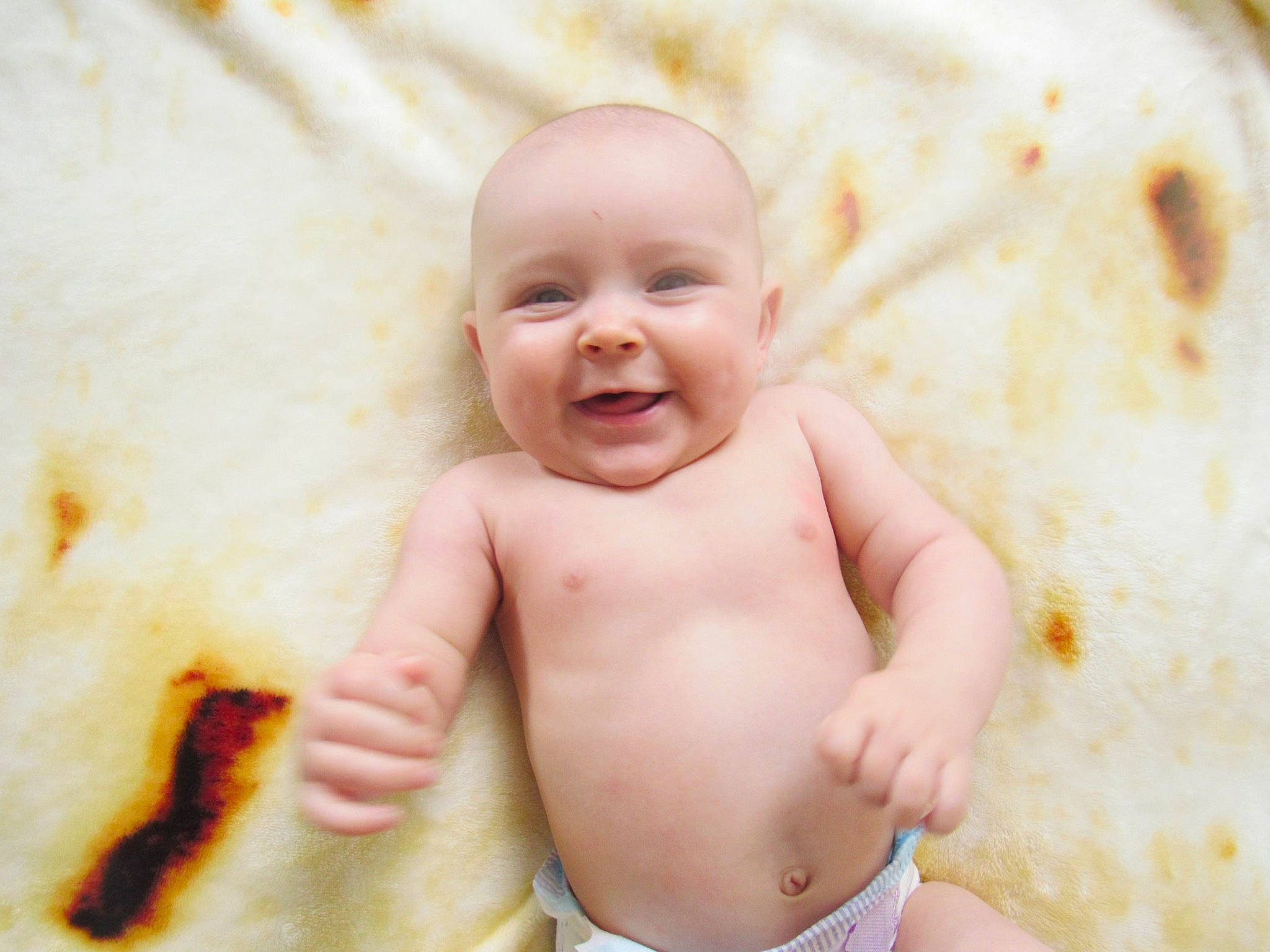 Mena is registered to the contest to win money with this photo: baby, baby_toddler_clothing, cheek, child, chin, comfort, face, finger, fun, gesture, happy, head, joy, mouth, nose, person, skin, sleeve, smile, stomach