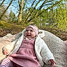 Romy participe au concours pour gagner de l'argent avec cette photo : baby, child, smiling, outdoor, blanket, pink_dress, headband, striped_tights, white_jacket, nature, trees, grass, pond, sunlight, happy, infant, portrait, cute, cozy, seasonal