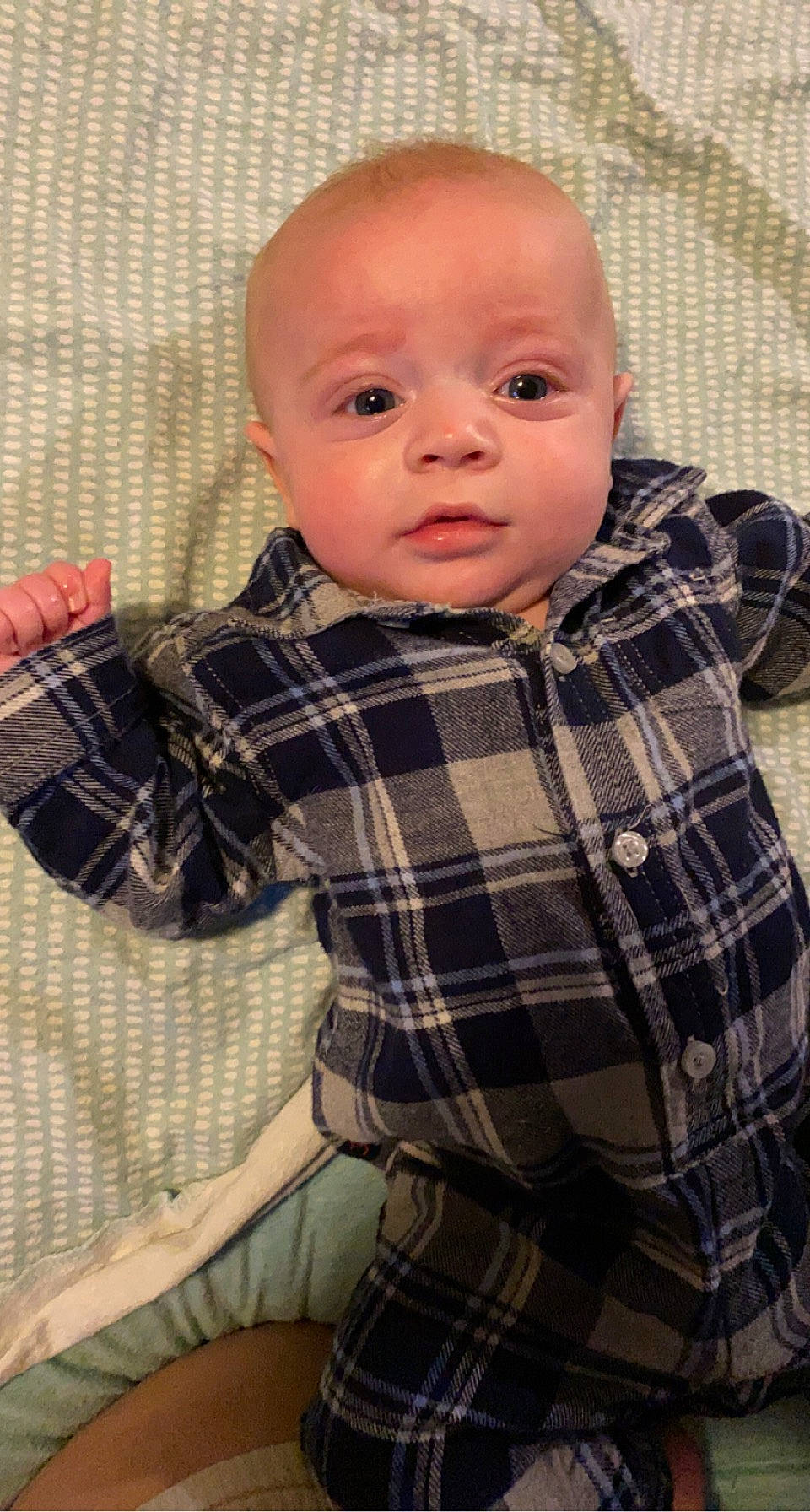 Karson is registered to the contest to win money with this photo: baby, baby_toddler_clothing, cheek, child, collar, comfort, dress_shirt, face, head, linens, pattern, person, plaid, sitting, skin, sleeve, tartan, textile, toddler