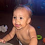 Axeill is registered to the contest to win money with this photo: baby, child, toddler, diaper, smiling, happy, indoor, living_room, toy, carpet, couch, furniture, skin, face, hand, cute, playful, young_child, expression, person