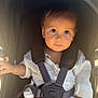 Axeill is registered to the contest to win money with this photo: toddler, child, stroller, baby, seatbelt, clothing, sunlight, outdoor, portrait, face, expression, hand, sitting, casual, young, cute, safety, infant, daylight, people