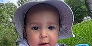 Axeill joined the competition — help win amazing prizes! baby, child, hat, white_clothing, blanket, grass, outdoor, trees, nature, sky, greenery, portrait, infant, cute, sunhat, relaxing, daytime, person, closeup, park