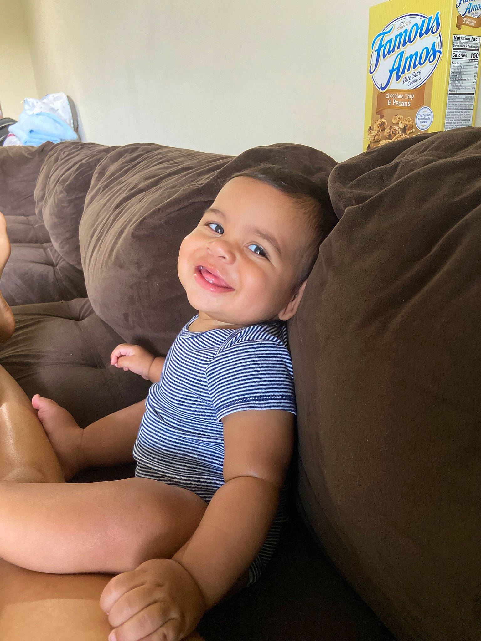 Adriel is registered to the contest to win money with this photo: abdomen, baby, barefoot, child, comfort, furniture, joy, leg, person, sitting, skin, smile, thigh, toddler