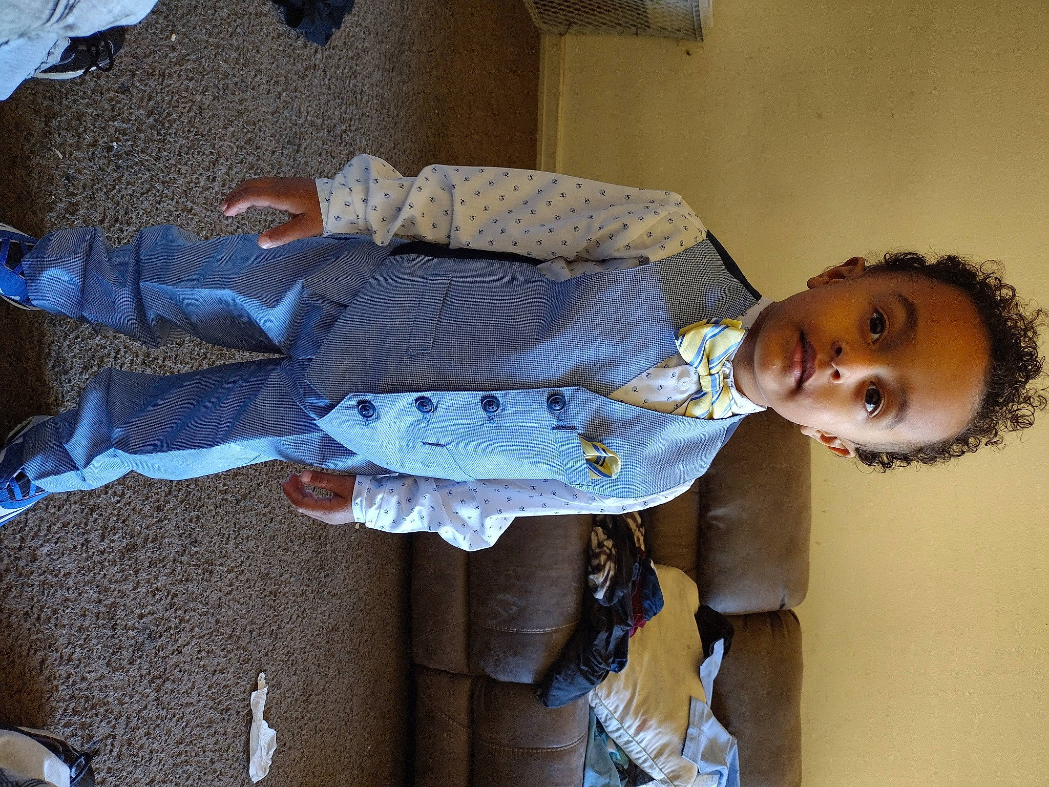 Armani is registered to the contest to win money with this photo: baby_toddler_clothing, child, comfort, dress_shirt, elbow, electric_blue, happy, person, room, sitting, sleeve