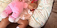 Melody is registered to the contest to win money with this photo: baby, bed, blanket, bodypart, clothing, couch, cushion, face, finger, furniture, hand, head, homedecor, hosiery, person, photography, pillow, portrait, sock, toy
