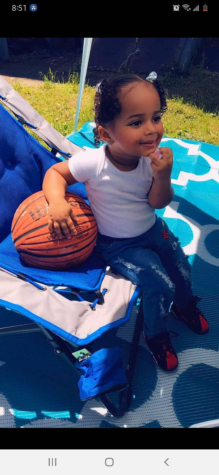 Alianna joined the competition — help win amazing prizes! automotive_tire, blue, child, cool, electric_blue, face, facial_expression, fun, grass, happy, head, leisure, motor_vehicle, person, recreation, sandal, shorts, sitting, snapshot, toddler