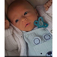 Kyron-James joined the competition — help win amazing prizes! baby, infant, pacifier, knitted_sweater, blue_outfit, bear_design, closeup, face, hand, cute, newborn, child, soft_lighting, portrait, expression, cozy, clothing, sleepwear, indoor, skin