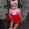 baby, bib, bow, child, couch, face, floral, furniture, happy, headband, indoors, infant, photography, pink, portrait, red_dress, shoes, sitting, smiling, sofa